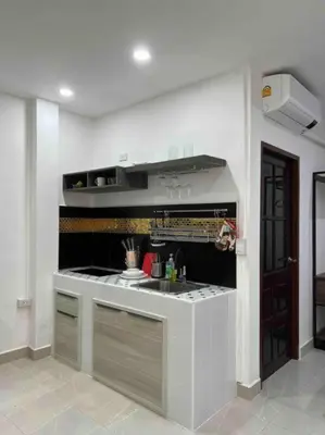 a kitchen with a sink and a counter top at Charming Villa Suite with Cozy Terrace near Beach in Patong Beach