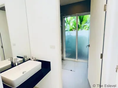 a bathroom with a white sink and a shower at Anchan House KML Welcome in Kamala Beach