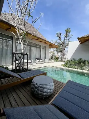 a house with a swimming pool and a patio at Bang Tao Anchan Flora 3 bd in Ban Phru Champa