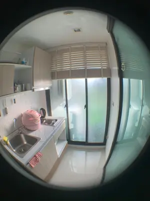 a kitchen with a view of a sink and a window at Beautiful space in Ban Sam Kong