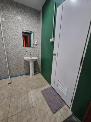 a bathroom with a sink and a mirror at Bonanza Patong Beach II Red Room in Patong Beach