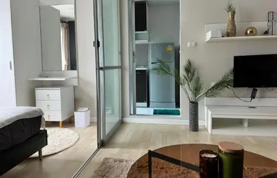 a living room with a couch and a tv at Lux Center Apartment in Kathu