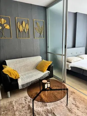 a living room with a couch and a coffee table at Lux Center Apartment in Kathu