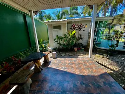 a patio with two benches and a house at 2 Bedrooms House with Private Pool the heart of rawai in Ban Saiyuan (1)
