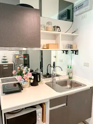a kitchen with a sink and a counter top at Central Pool in Ban Lo Long