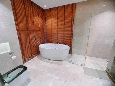 a bathroom with a tub and a shower and a toilet at Rare Sunrise Cliff Villa 5 Bedrooms in Ban Lo Ti Pa (1)