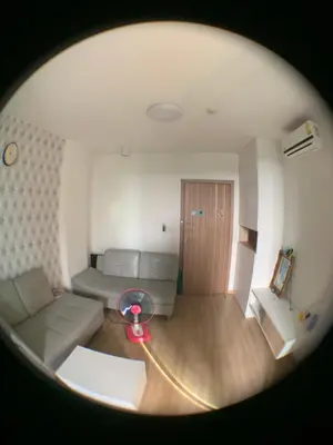 a living room with a couch and a table at Fab condo in Ban Tha Khreng
