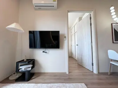 a living room with a flat screen tv on the wall at DLUX 7TH Floor in Ban Klang