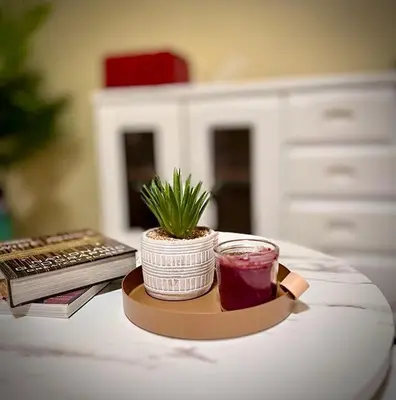 a plant on a tray on a table with a keyboard at Casa Gris with Shared Pool in Ban Bo Han