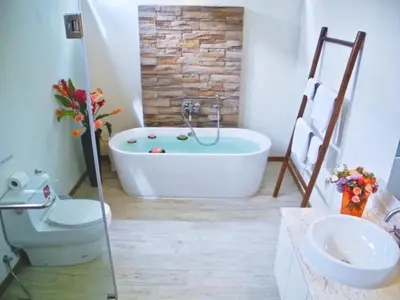a bathroom with a tub and a toilet and a sink at Rawai Beach Pool Villa 3 bedrooms in Rawai Beach