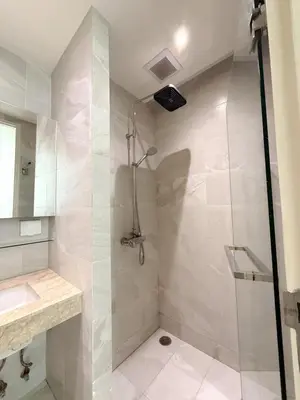 a bathroom with a shower and a sink at The Rocco pool view in Krabi town