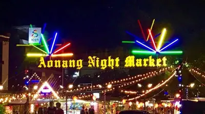 a group of neon signs at a market at night at Cat Home Ao Nang Landmark in Ao Nang Beach