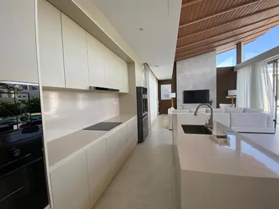 a kitchen with white cabinets and a sink at 3bdr New Modern Pool Villa Bangtao ASH-05 in Ban Phru Champa