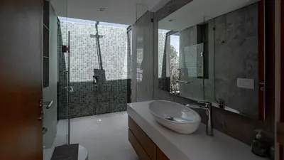 a bathroom with a sink and a shower at Luxury Modern Loft Villa Riverhouse in Laguna Phuket