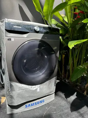 a samsung washing machine in a bag next to some plants at Villa Aileen Naithon in Nai Thon Beach
