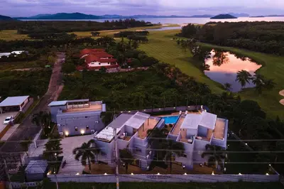 an aerial view of a house with a lake at Modern Comfort in Paradise - Villa Argent 6 with 3BR and Access to Tropical Pool in Thalang