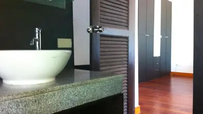 a bathroom with a white sink on a counter at Villa Loma 3 Chambres in Patong Beach