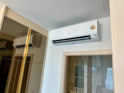 a kitchen with a air conditioner on the ceiling at Bellevue Lagoon Phuket in Laguna Phuket