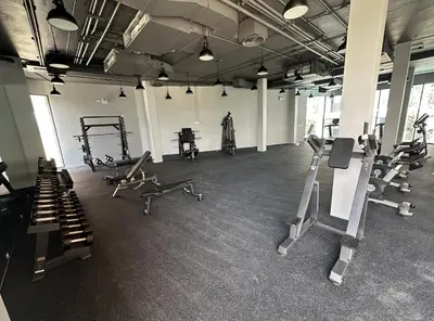 a gym with several treadmills and machines in it at Bellevue Lagoon Phuket in Laguna Phuket