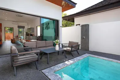 a house with a swimming pool in the backyard at Thai Balinese Villa Rico in Kamala 3BR, Private Pool in Kamala Beach