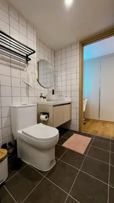 a bathroom with a toilet and a sink and a mirror at Fantasea Kamala 1 BR Apartments Near Beach 212 in Kamala Beach