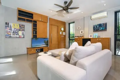 a living room with a white couch and a ceiling fan at Nature & Serenity - Exclusive Villa-Pavilion P06 in Natural Park Residence near Kamala Beac in Kamala Beach