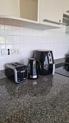 a kitchen counter with two toasters and a toaster at One bed Apartment Nai Yang in Nai Yang Beach