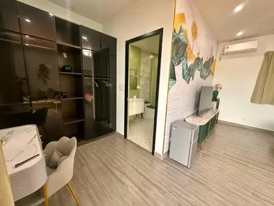 a room with a bathroom with a sink and a mirror at Chuan SeaFront Villa Rawai Phuket in Rawai Beach