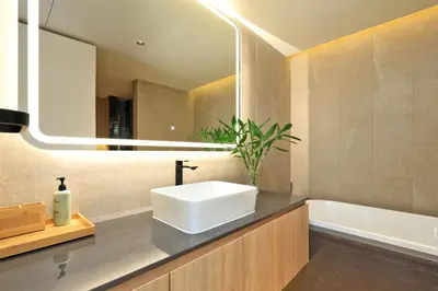 a bathroom with a sink and a mirror and a tub at 2bdr Apartment with Bath near Bangtao Beach C512 in Laguna Phuket