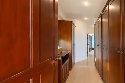 a hallway with wooden cabinets and a hallway with at Over the Moon villa in Patong Beach