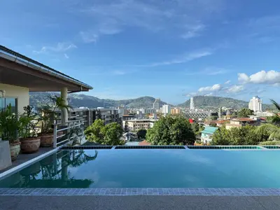 a swimming pool with a view of the city at Over the Moon villa in Patong Beach