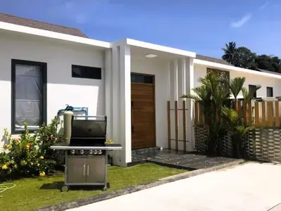 a barbecue in front of a house at 20 - Tranquil Retreat near Marriott Naiyang Beach in Nai Yang Beach