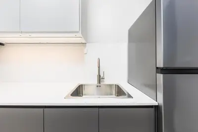 a kitchen with a sink and a refrigerator at Villa Neya 2BR Private Pool Close to Naiharn Beach in Rawai Beach