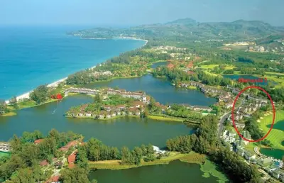 an aerial view of a lake with a red circle at Private apartment at Allamanda II by Lofty in Bang Tao Beach