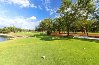 a view of a golf course with trees and water at Private apartment at Allamanda II by Lofty in Bang Tao Beach