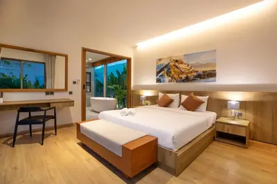 a hotel room with a bed and a desk and a desk at Luxury Villa in heart of Bang Tao! Villa BEAM in Laguna Phuket