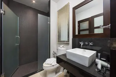 a bathroom with a sink and a toilet and a shower at VILLA Hanga 3BR Private Pool Nai Harn Beach in Nai Harn Beach