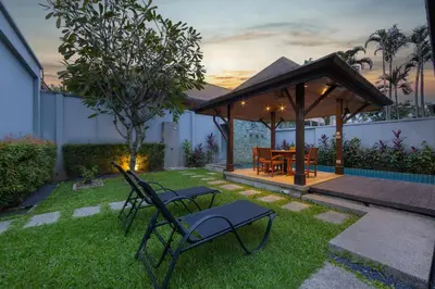 a gazebo with a table and chairs in a yard at VILLA Hanga 3BR Private Pool Nai Harn Beach in Nai Harn Beach