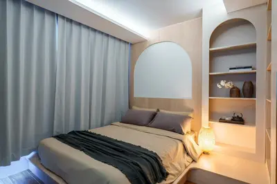 a bedroom with a large bed with a window at Stylish 1 bdr Kamala beach Roof Pool Gym free wifi in Kathu