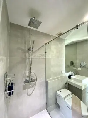 a bathroom with a shower and a toilet and a sink at Seaview Duplex Home - Panwa Beach - Baan Jayden in Phuket Town