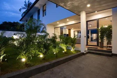 a house with lights in front of it at Sumptuous 4 bedroom pool villa at rawai beach RB 2 in Rawai Beach