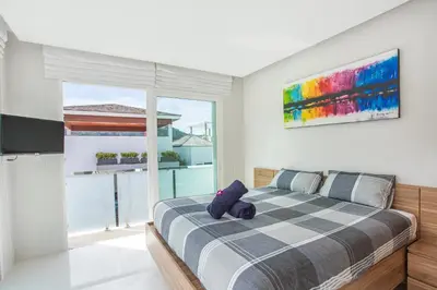 a bedroom with a bed with a teddy bear on it at Private 4BR Pool Villa Skylight with Stunning Views of Kamala Green Hills in Kamala Beach
