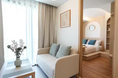 a living room with a couch and a bed at Dream 1 BdR Kamala Beach Free Parking WiFi Gym in Kathu