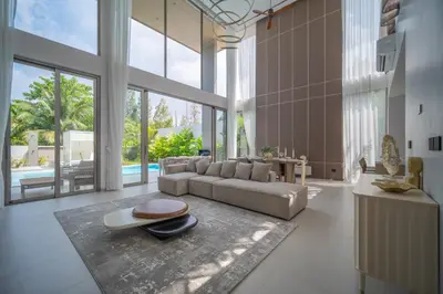 a living room with a couch and a table at Grand View Residence Villa by NLA in Bang Tao Beach