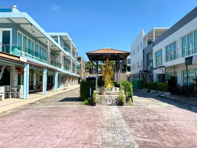 a statue in the middle of a street with buildings at The Pixel Cap Panwa Sea front Condominium - By Lovly in Ban Ao Makham