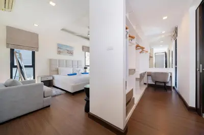 a bedroom with a bed and a living room at Phuket villa in Laguna in Bang Tao Beach