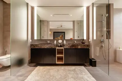 a bathroom with a sink and a mirror at Luxury Penthouse 407sqm Beachfront and private pool in Phuket Town