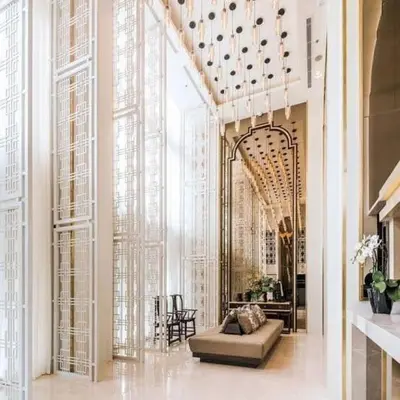 a lobby with a couch in the middle of a building at The Base Height Condo with Rooftop infinity pool in Ban Sam Kong