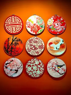 a group of plates with flowers on a wall at The Base Height Condo with Rooftop infinity pool in Ban Sam Kong