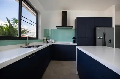 a kitchen with blue and white counters and a refrigerator at Superb 3-bedrooms pool villa in Rawai, Naiharn villa Moana in Rawai Beach